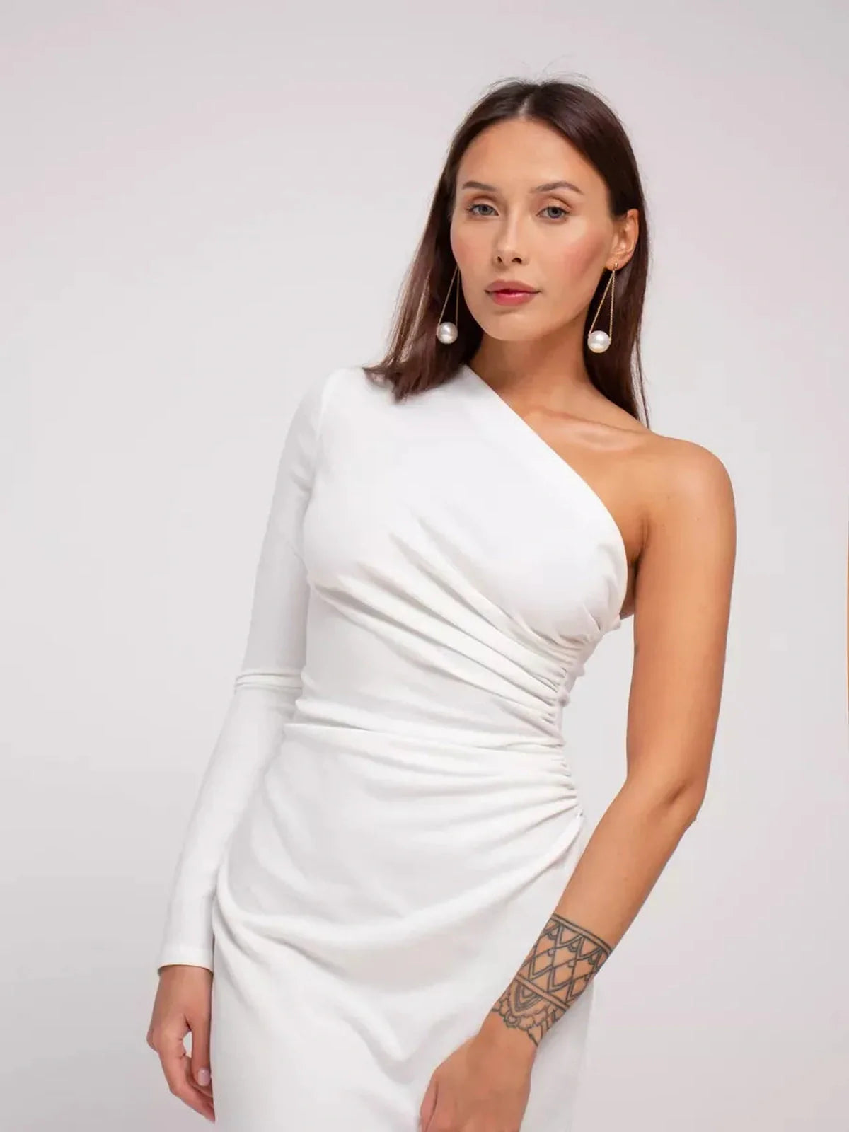 Celeste Maxi Dress featuring a one-shoulder design, draped details in soft white fabric, ideal for formal occasions.