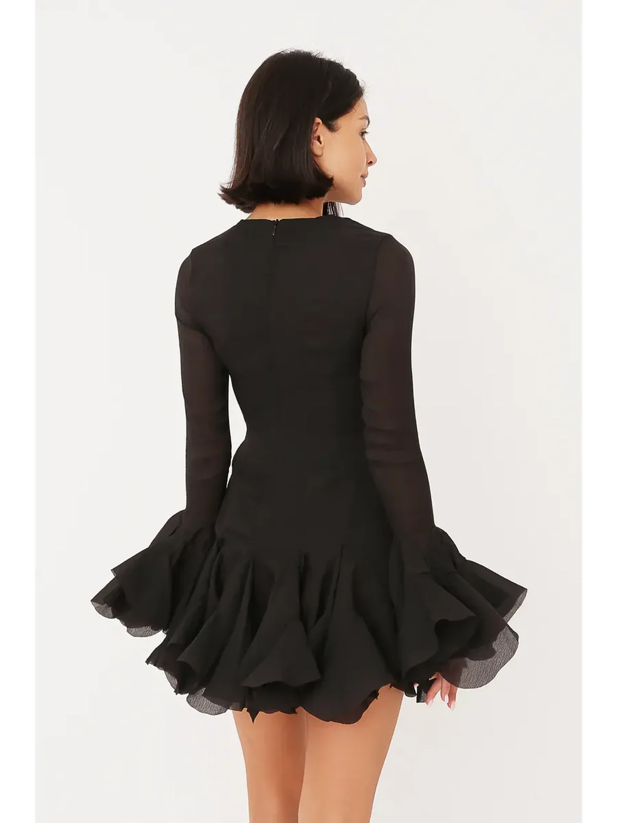 Back view of a chic black Ruffle Flare Mini Dress featuring layered ruffles and bell sleeves, perfect for parties and special occasions.