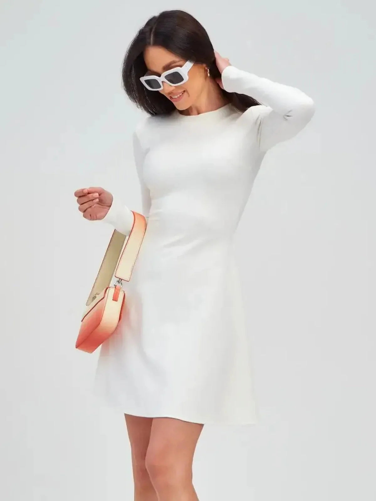 Ivory Sculpt Dress, a minimalist white dress featuring a fitted bodice and flared A-line skirt, perfect for summer occasions.