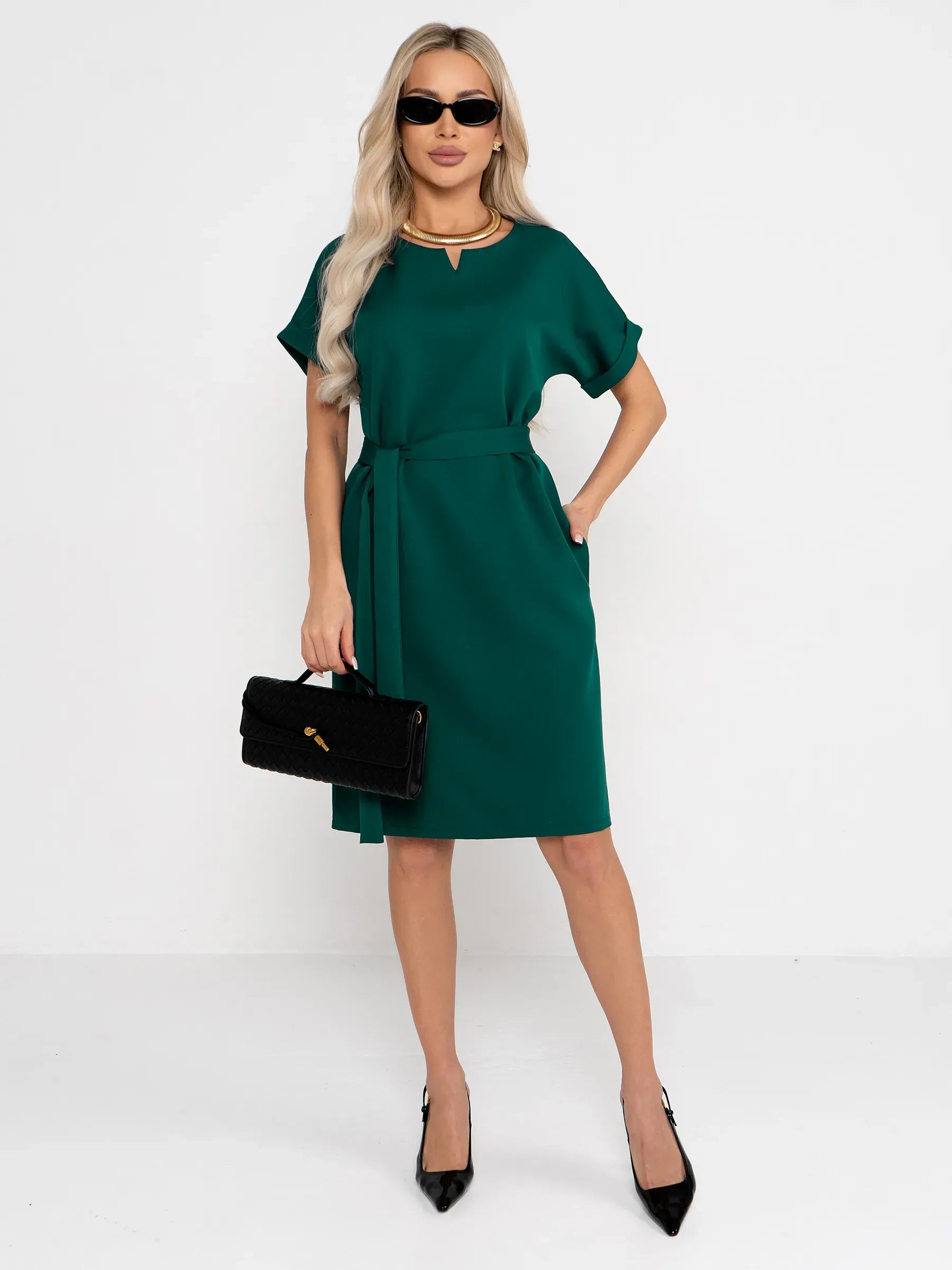 Emerald Mode green mini dress featuring a notched neckline, cuffed sleeves, and fabric belt, perfect for weddings and parties.