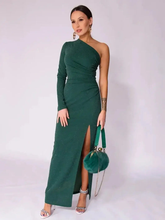 Emerald Spark Maxi Dress featuring one-shoulder design, high side slit, and shimmer for elegant summer or wedding guest attire.