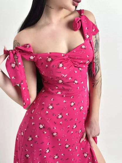 Rosé Charm Midi Dress featuring a floral print, sweetheart neckline, and adjustable tie straps, perfect for summer and special events.