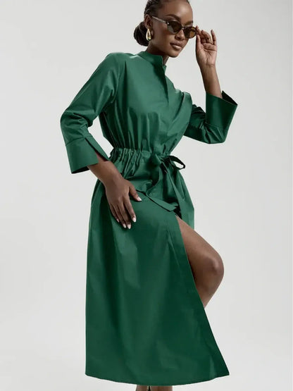 Emerald Ease Midi Dress in green with a structured collar, waist tie, and elegant silhouette, perfect for summer and special occasions.