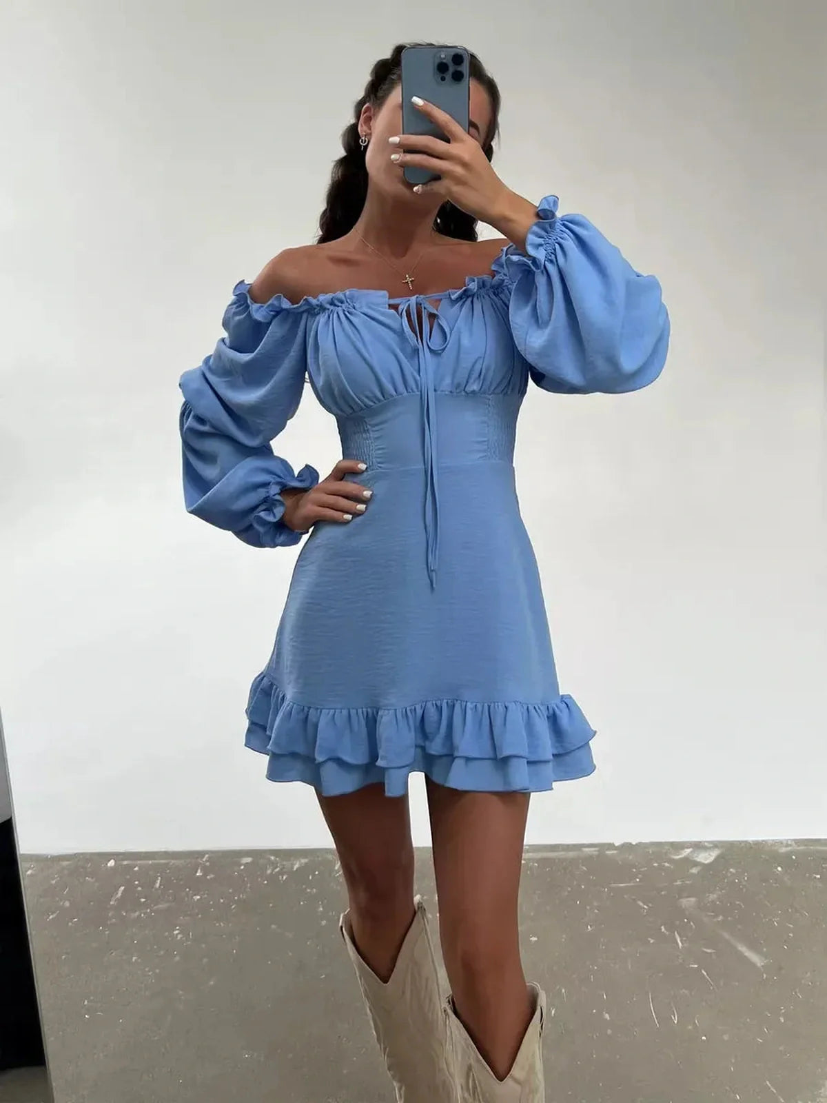 Sky-blue Boho frill mini dress with off-shoulder neckline and ruffle detail, perfect for summer events and weddings.