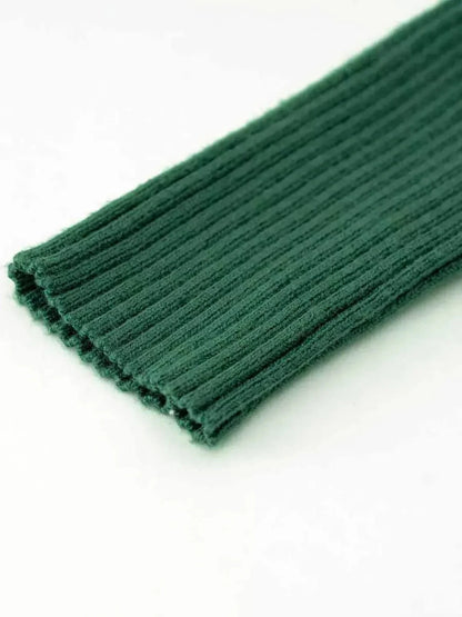 Close-up of lush forest green ribbed knit fabric, showcasing the texture ideal for Midi Dress and summer dresses.