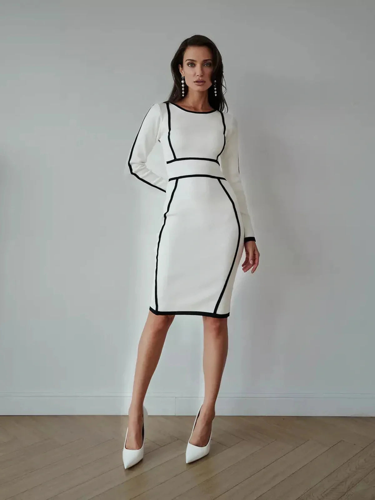 Elegant white midi dress with black piping, perfect for formal events, wedding guest attire, and chic summer styling.