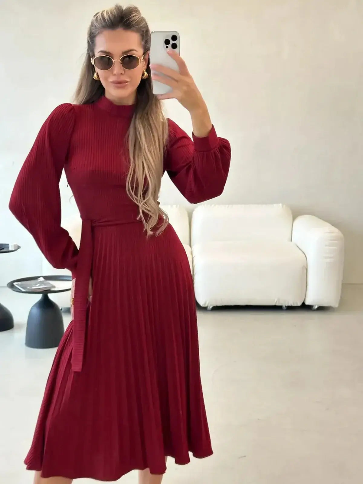 Crimson Grace Midi Dress featuring statement pleats and a form-fitting ribbed bodice in a rich red hue.