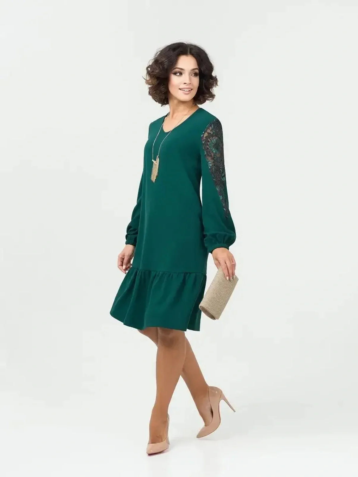 Elegant green mini dress with lace sleeves, perfect for weddings, parties, or casual outings, combining comfort and style.