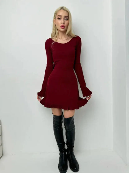 Stylish woman in a crimson red mini dress with flared sleeves, perfect for cocktail, prom, or homecoming events.