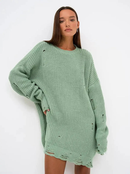 Frost Knit Mini dress in mint green, featuring a chunky knit texture and distressed details, perfect for casual stylish looks.