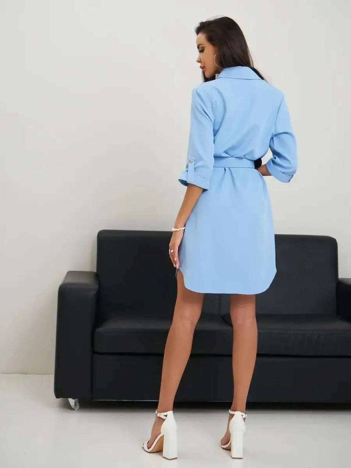 Back view of a chic sky-blue Skyline Mini Dress with rolled sleeves and adjustable belt, perfect for summer outings.