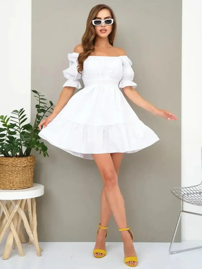 Model wearing a stylish white off-shoulder summer dress with puff sleeves, perfect for weddings and casual outings.