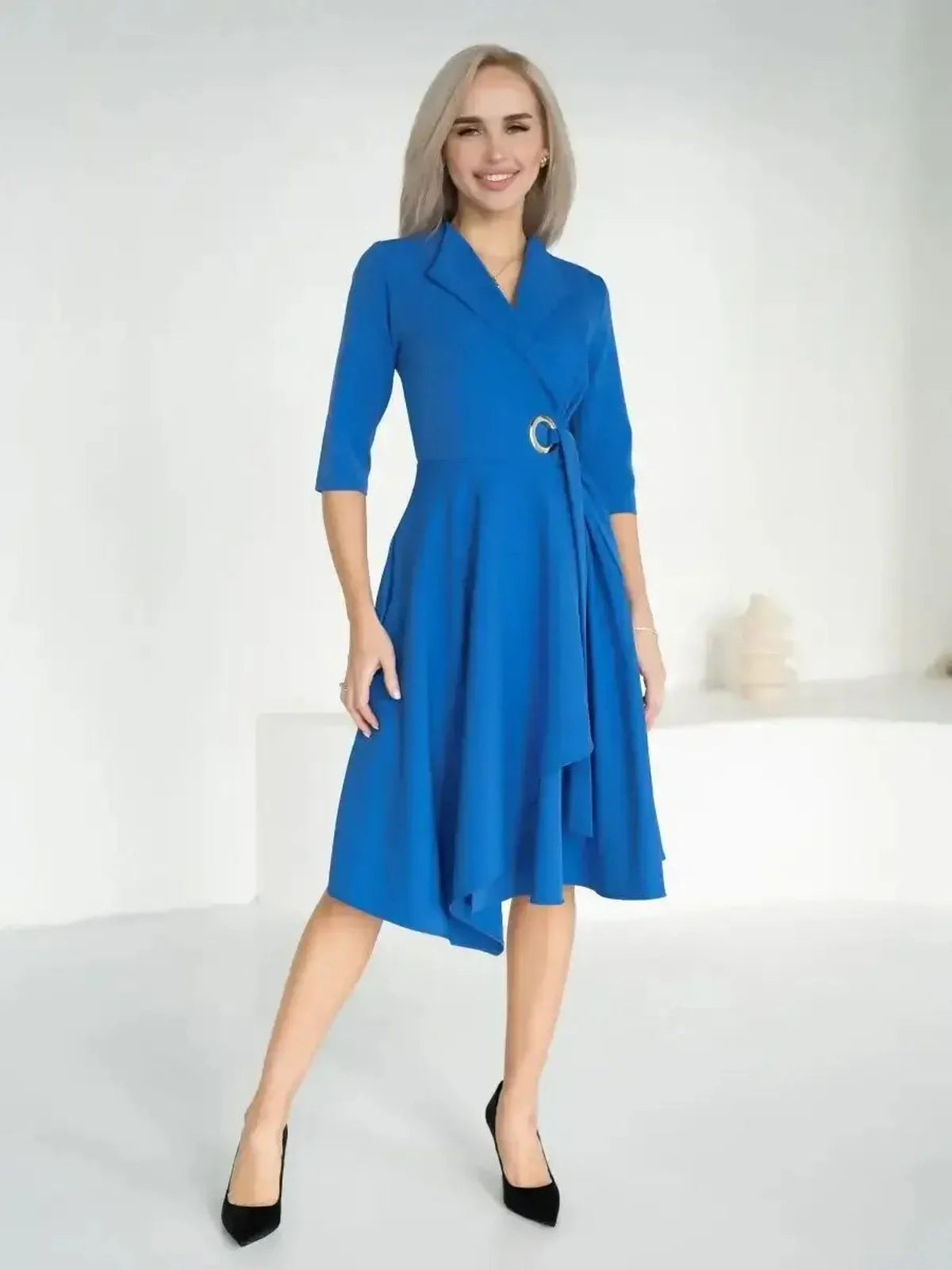 Sapphire Flow Midi Dress in royal blue, featuring a draped wrap style and metallic waist detail, perfect for elegant occasions.