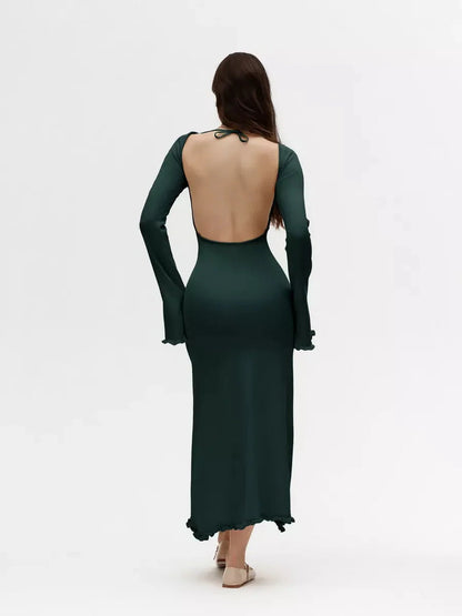 Back view of the Serenity Knit Midi Dress showcasing an open back and flounced sleeves, perfect for weddings or formal events.