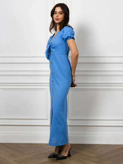 Elegant sky-blue maxi dress with V-neck, waist tie, and button details, perfect for formal events and summer occasions.