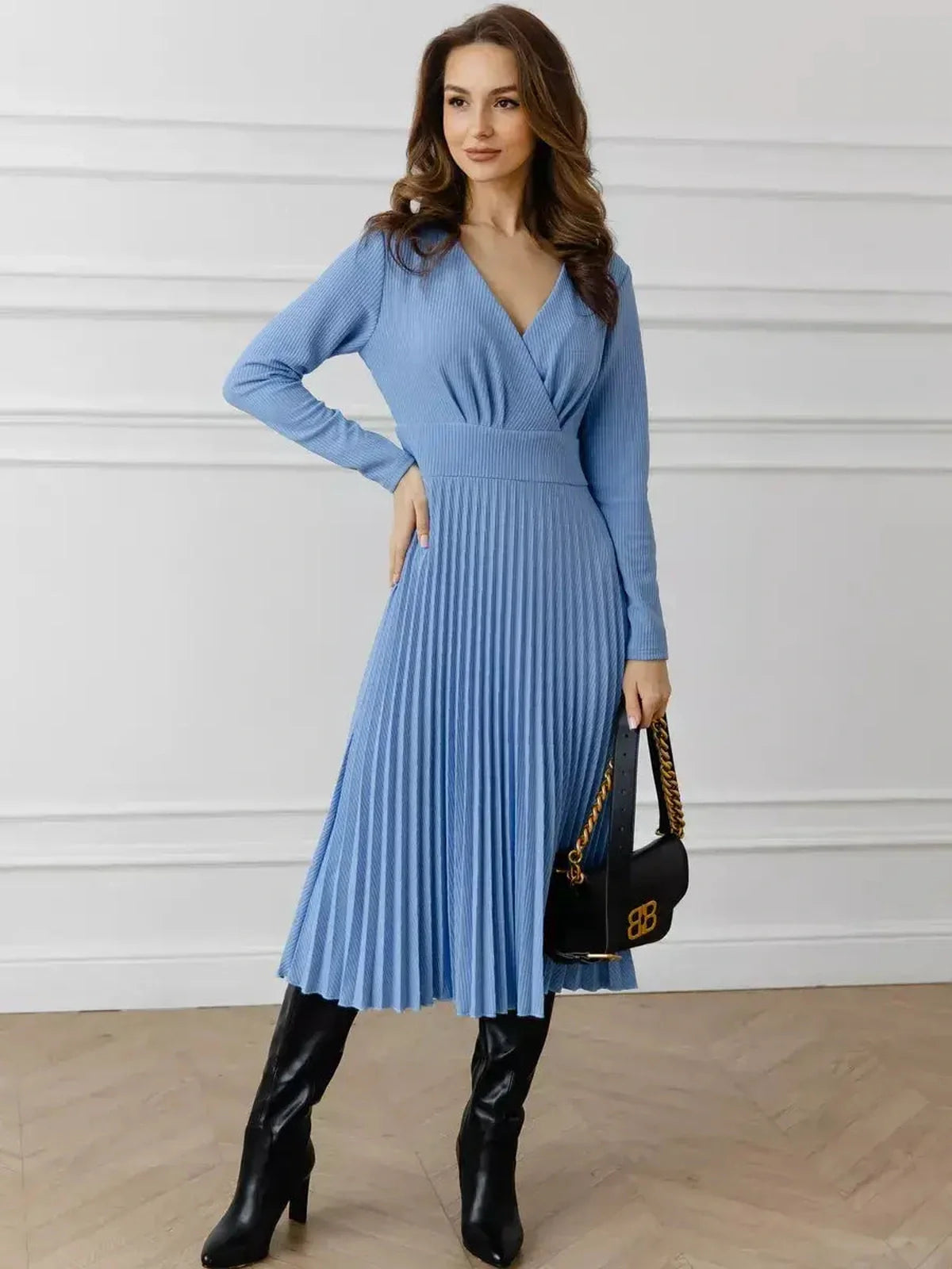 Celeste Midi Dress in sky blue with elegant pleats and V-neck, perfect for wedding guest or cocktail events.