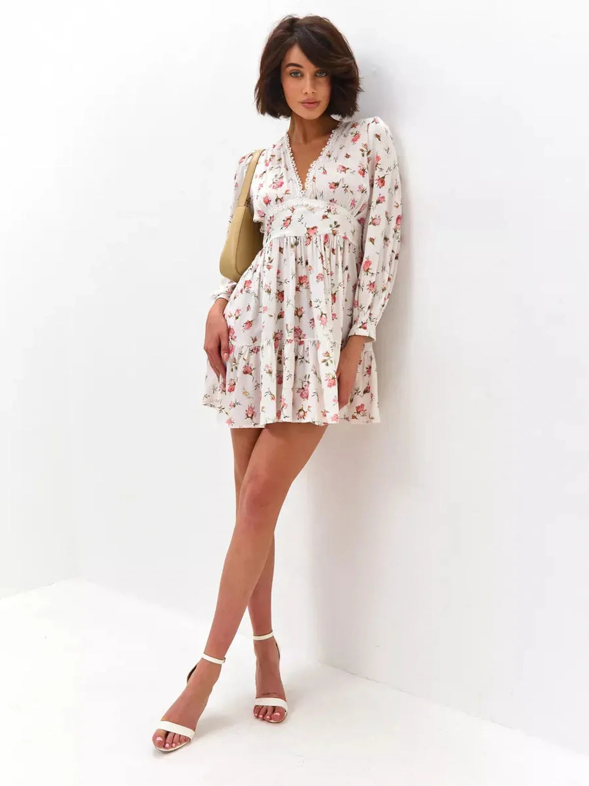 Rose Whimsy Mini Dress featuring floral details, lace trim, and a playful silhouette, perfect for summer celebrations.