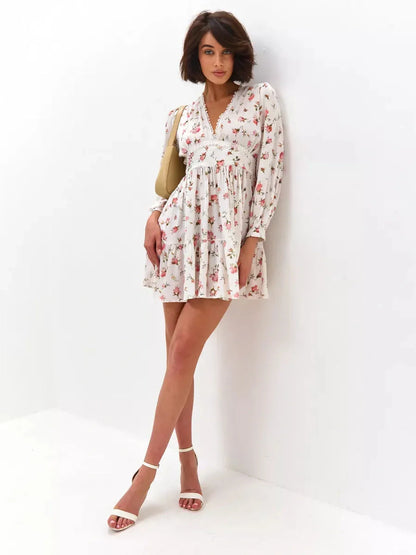 Rose Whimsy Mini Dress featuring floral details, lace trim, and a playful silhouette, perfect for summer celebrations.