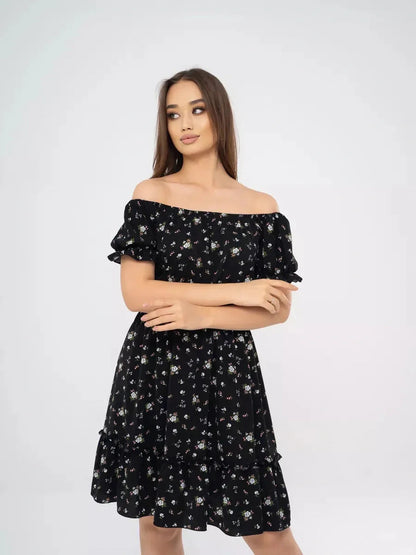 Elegant off-shoulder black dress with floral print, perfect for summer weddings and casual outings.