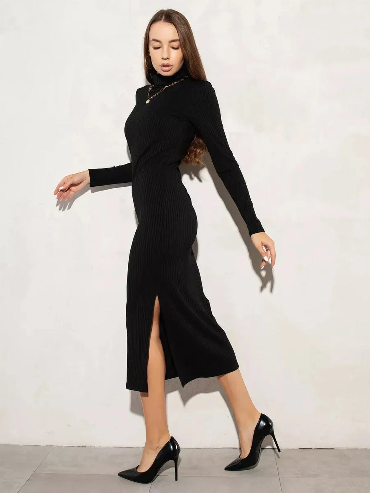Sleek black Sculpted Rib Midi Dress with side slit and turtleneck, perfect for weddings, graduations, and formal occasions.