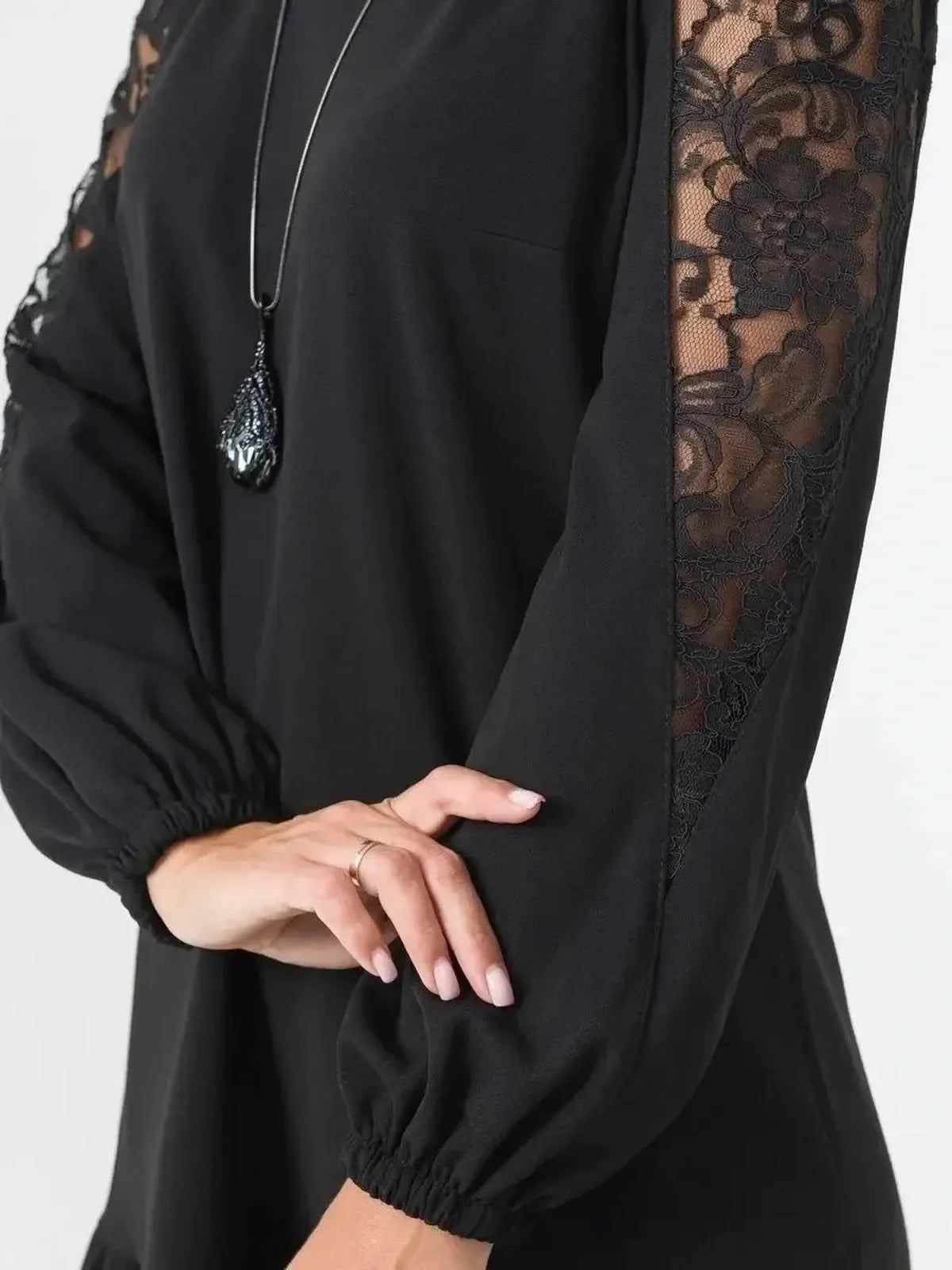 Elegant black dress featuring sheer floral lace sleeves, perfect for weddings, proms, and formal events.