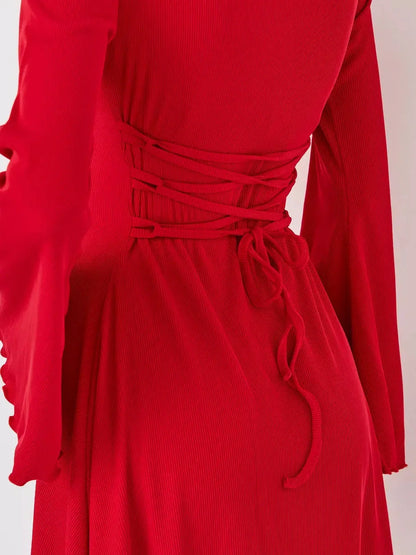 Close-up of the back detail of a red flare cutout mini dress, showcasing its stylish lacing and form-fitting design.