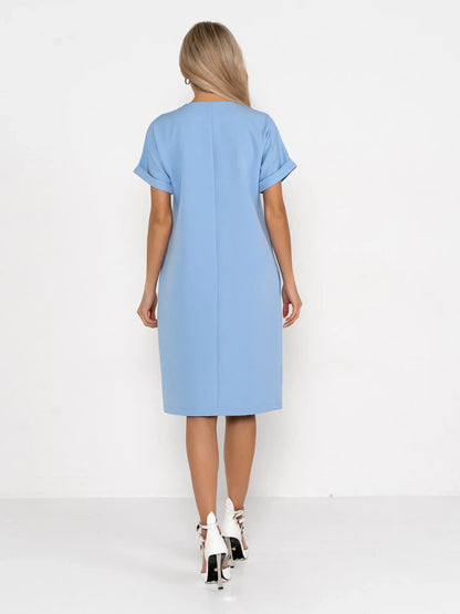 Back view of a light blue mini dress, featuring a relaxed sheath silhouette and rolled sleeves, perfect for summer or casual wear.