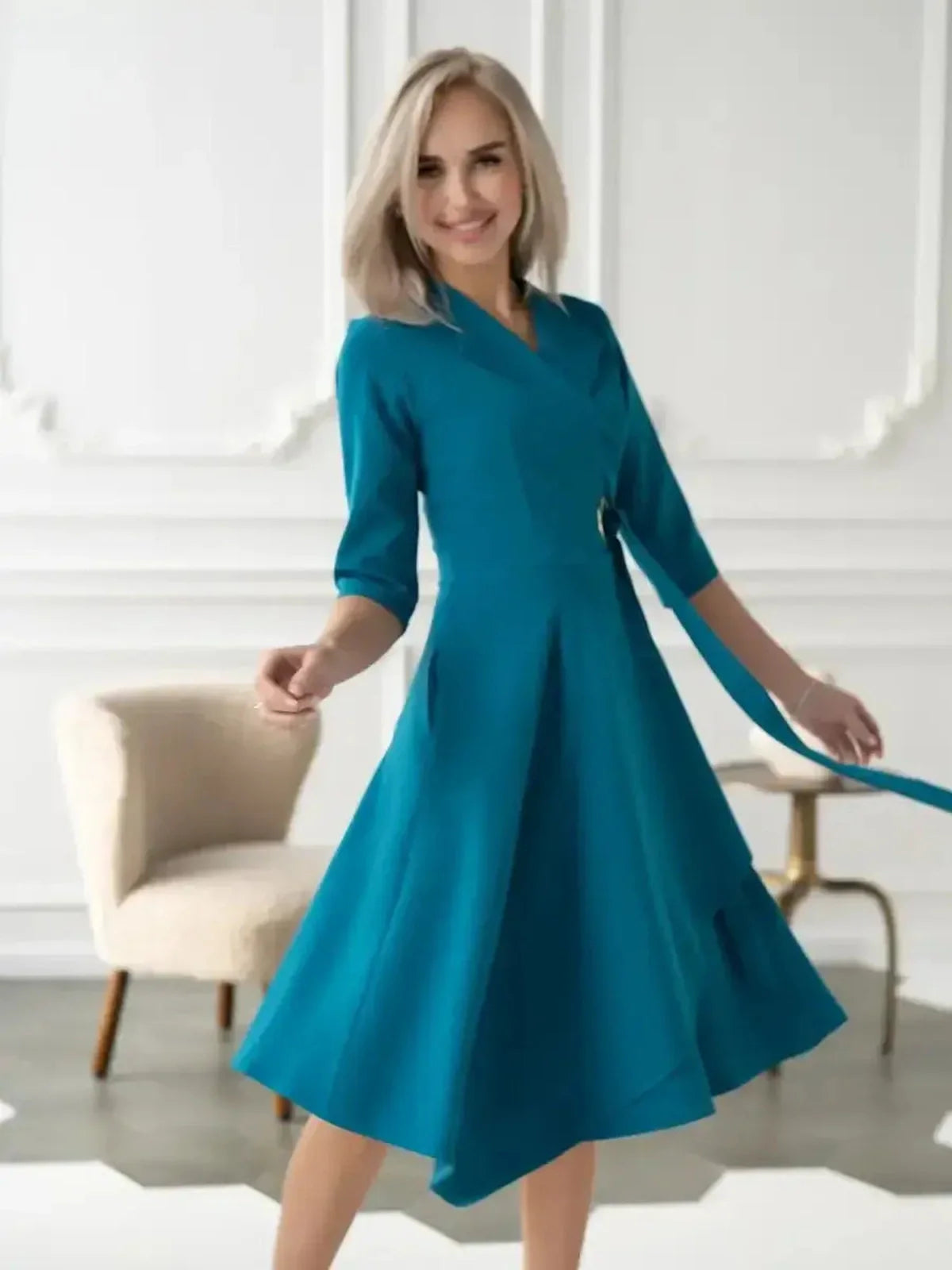 Sea Grace Midi Dress in teal, featuring a tailored wrap style and elegant A-line skirt, perfect for various occasions.