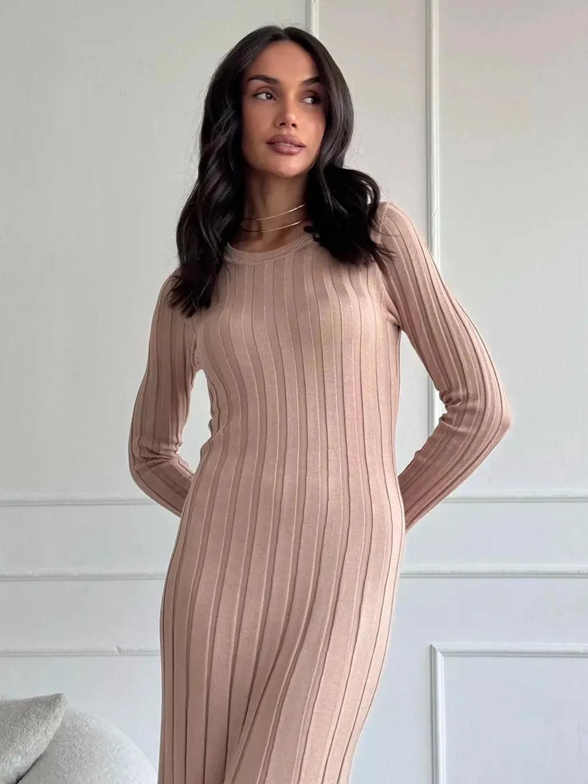 Sahara Curve Maxi Dress in sandstone beige, showcasing a sculpted fit and soft ribbed texture, perfect for weddings and special occasions.