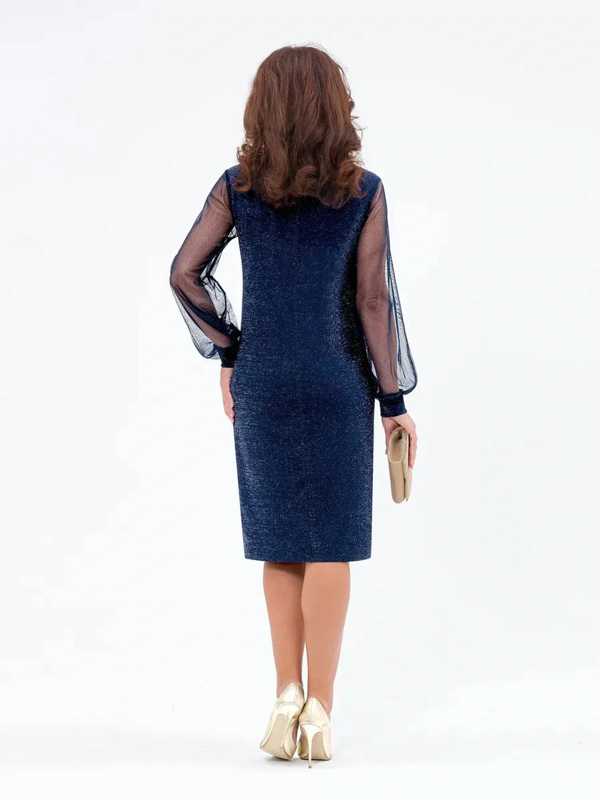 Back view of a woman wearing a navy blue Celeste Midi Dress with sheer sleeves, perfect for weddings and cocktail events.
