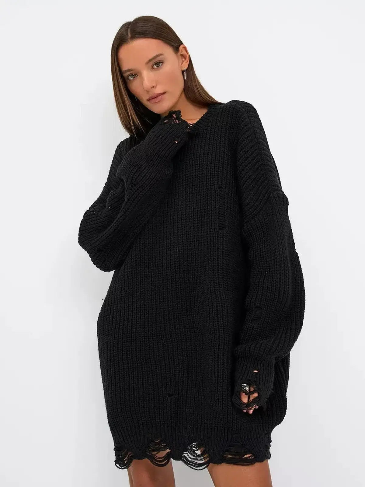 Oversized black Shadow Knit Mini dress with distressed texture, long sleeves, and raw hem, perfect for bold style.