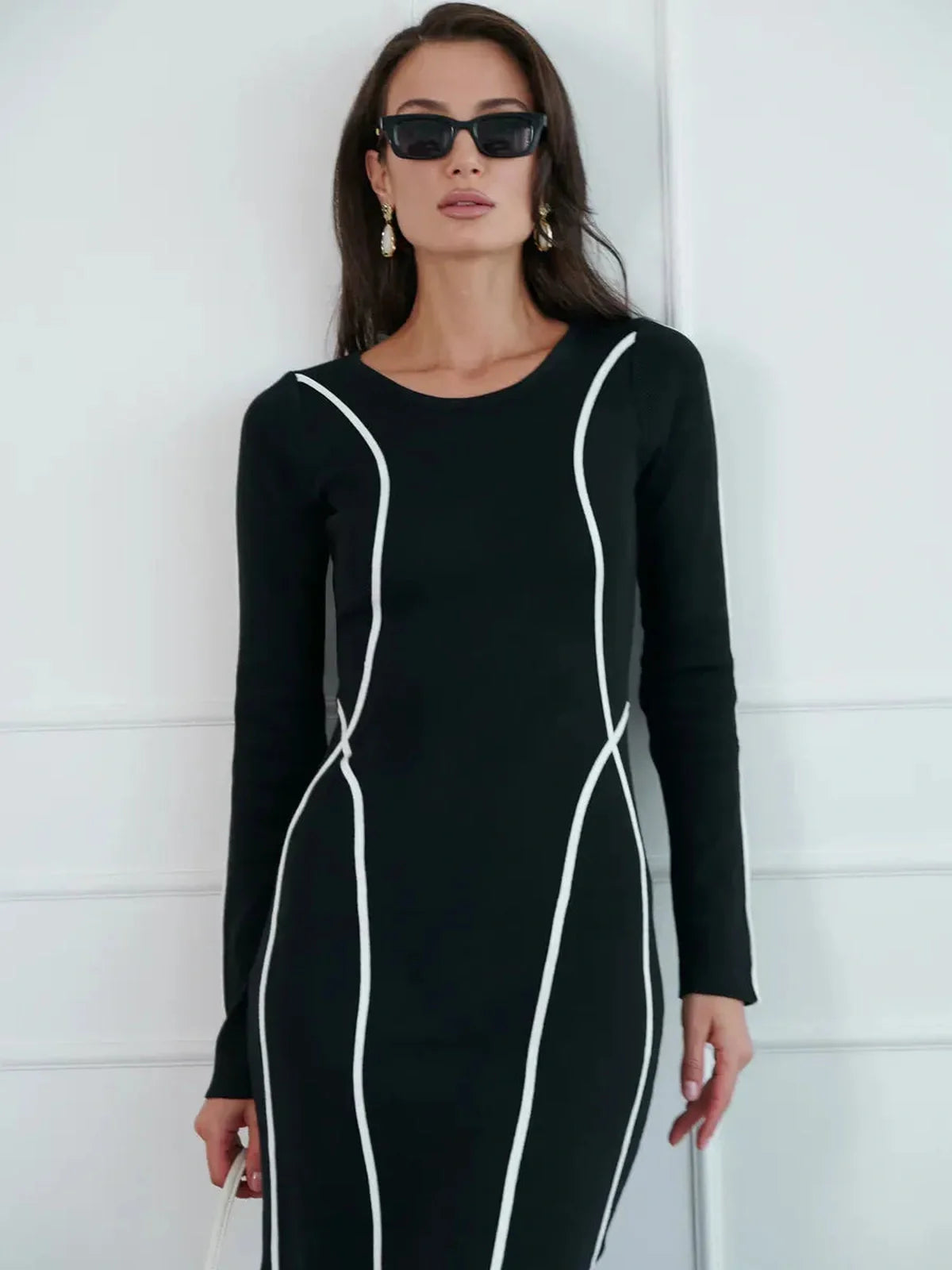 Midnight Curve Maxi Dress in black with contrast piping, showcasing a sculpting silhouette perfect for formal occasions.