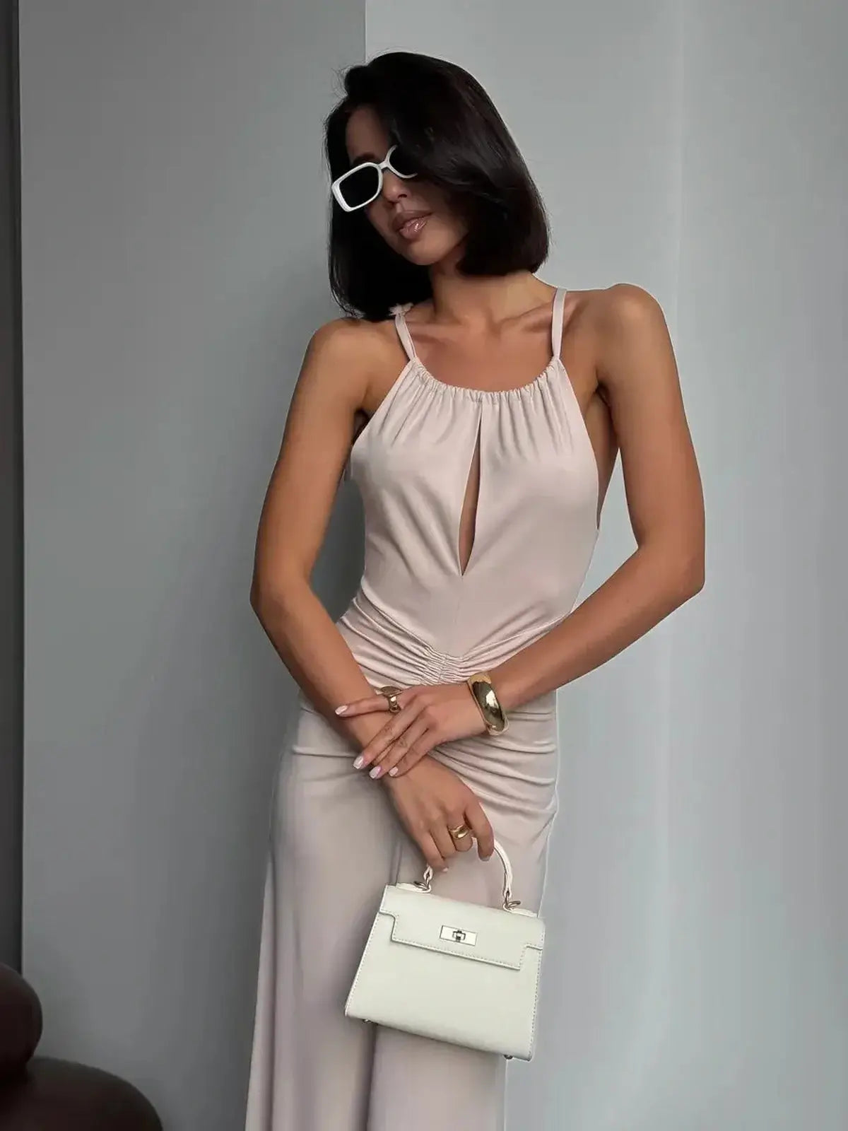 Serene Curve Maxi Dress featuring a halter neckline and ruched detailing, perfect for summer events.