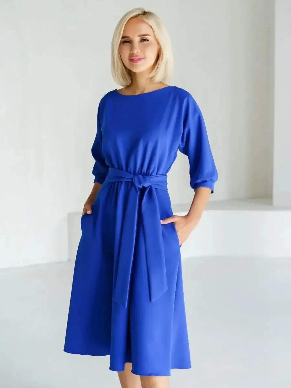 Sapphire Belted Midi Dress in electric blue, featuring a structured boat neckline and waist-defining belt, perfect for various occasions.