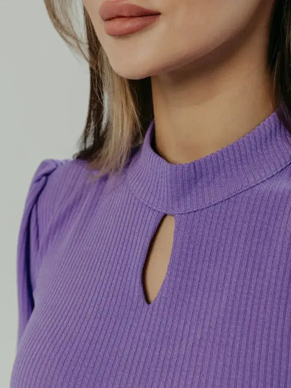 Close-up of a keyhole neckline on the violet Serena Midi Dress, showcasing elegant pleats and modern design.