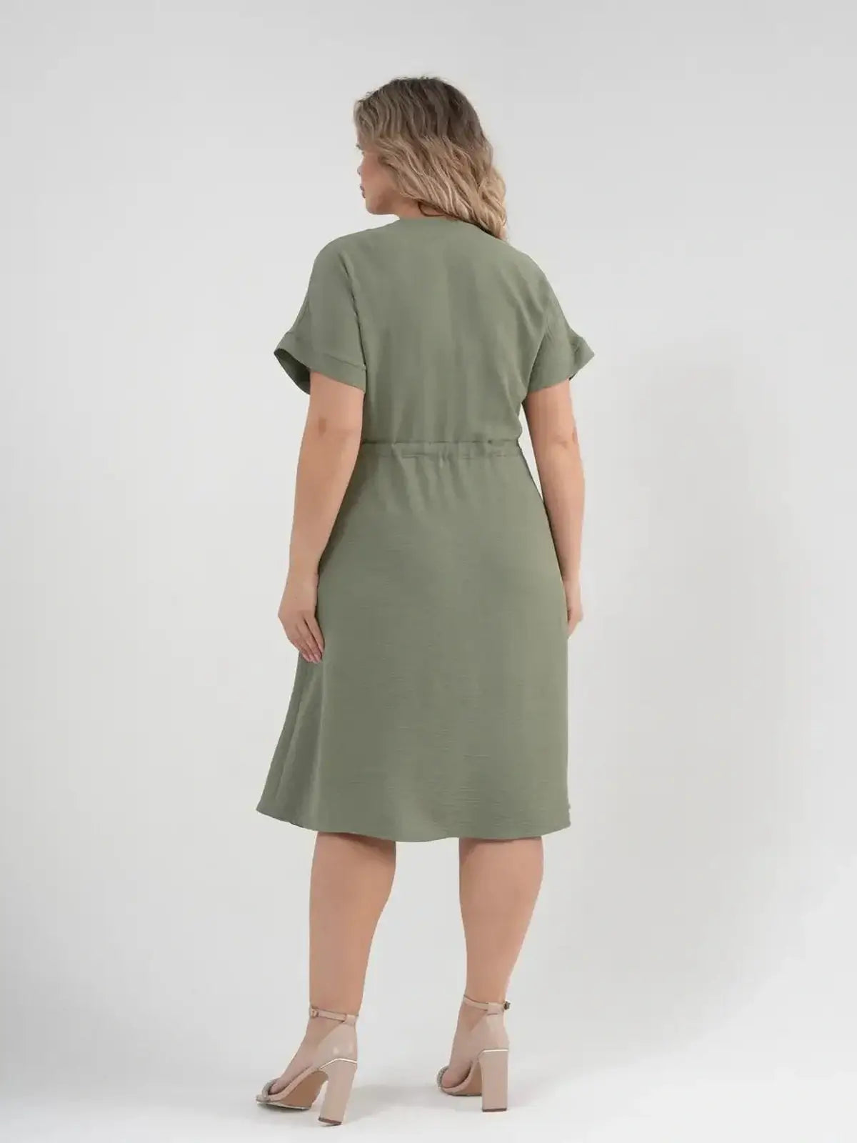 Back view of the Botany Midi Dress in khaki, featuring a cinched waist and short sleeves, perfect for summer elegance.