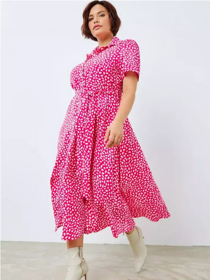 Fuchsia Petal Pop Midi Dress featuring an abstract white petal print, perfect for summer occasions and weddings.