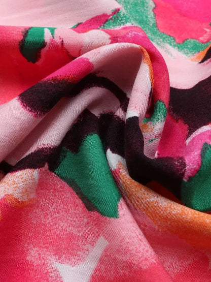 Close-up of vibrant, floral-patterned fabric showcasing colors perfect for summer dresses and midi dress designs.