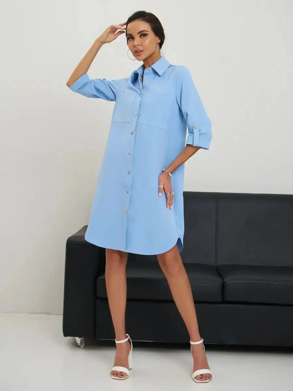 Skyline Mini Dress in sky blue, perfect for summer, featuring a shirt style, adjustable belt, and rolled sleeves.