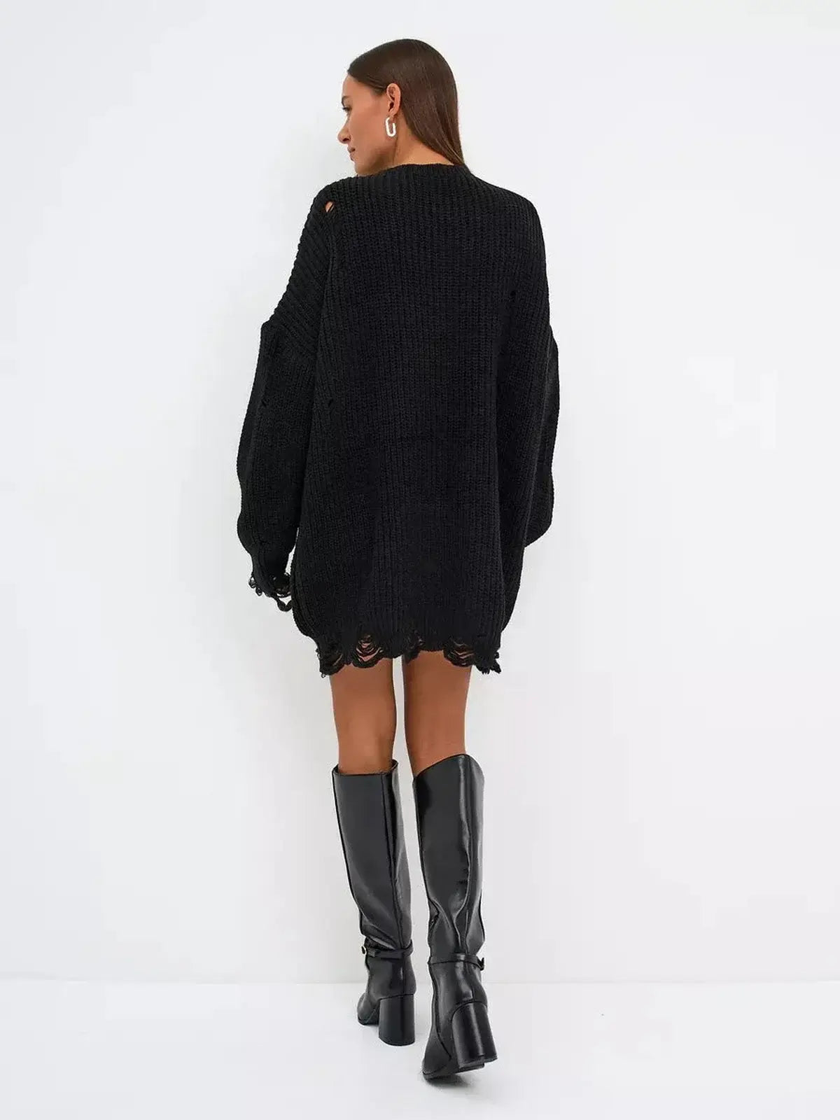 Back view of the Shadow Knit Mini black dress, showcasing its distressed texture and oversized fit.