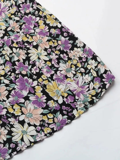 Floral pattern of the Botanic Bloom Midi Dress featuring colorful blooms on a black background, perfect summer attire.