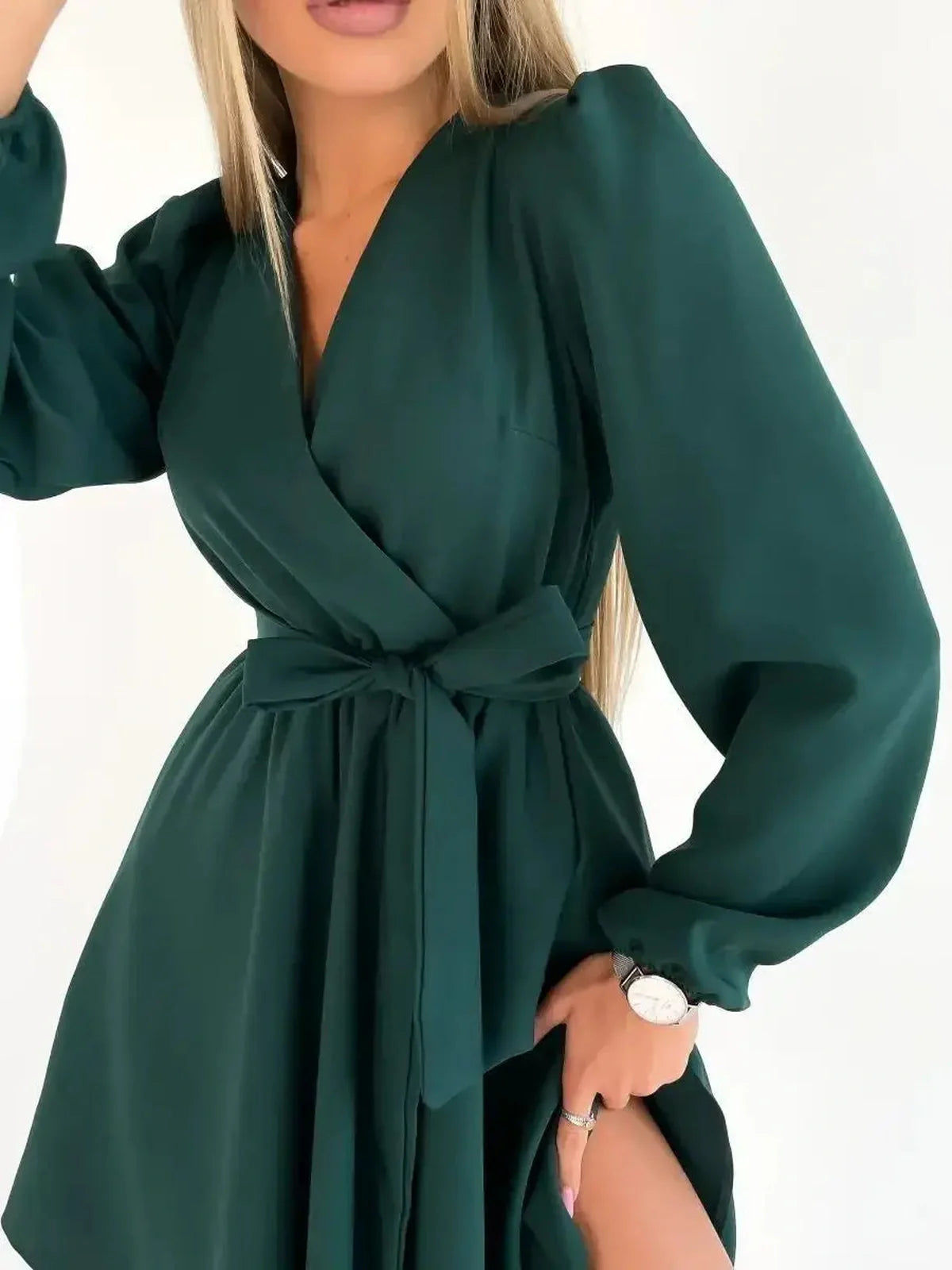 Emerald Charm mini dress featuring a wrap-style bodice and V-neckline, perfect for summer and formal occasions.