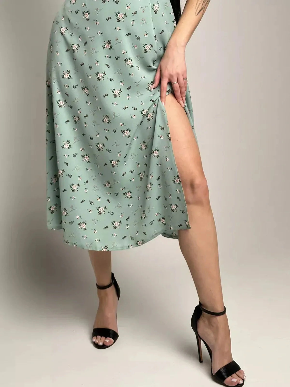 Flora Grace Midi Dress showcasing romantic florals and a thigh-high slit, perfect for summer events and weddings.
