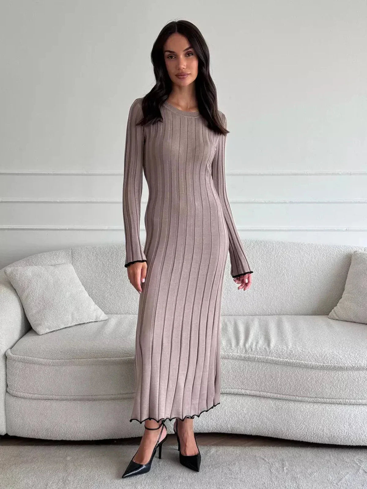 Elegant Contour Maxi Dress in soft ribbed knit, showcasing a form-fitting silhouette with ruffle hem, perfect for any occasion.