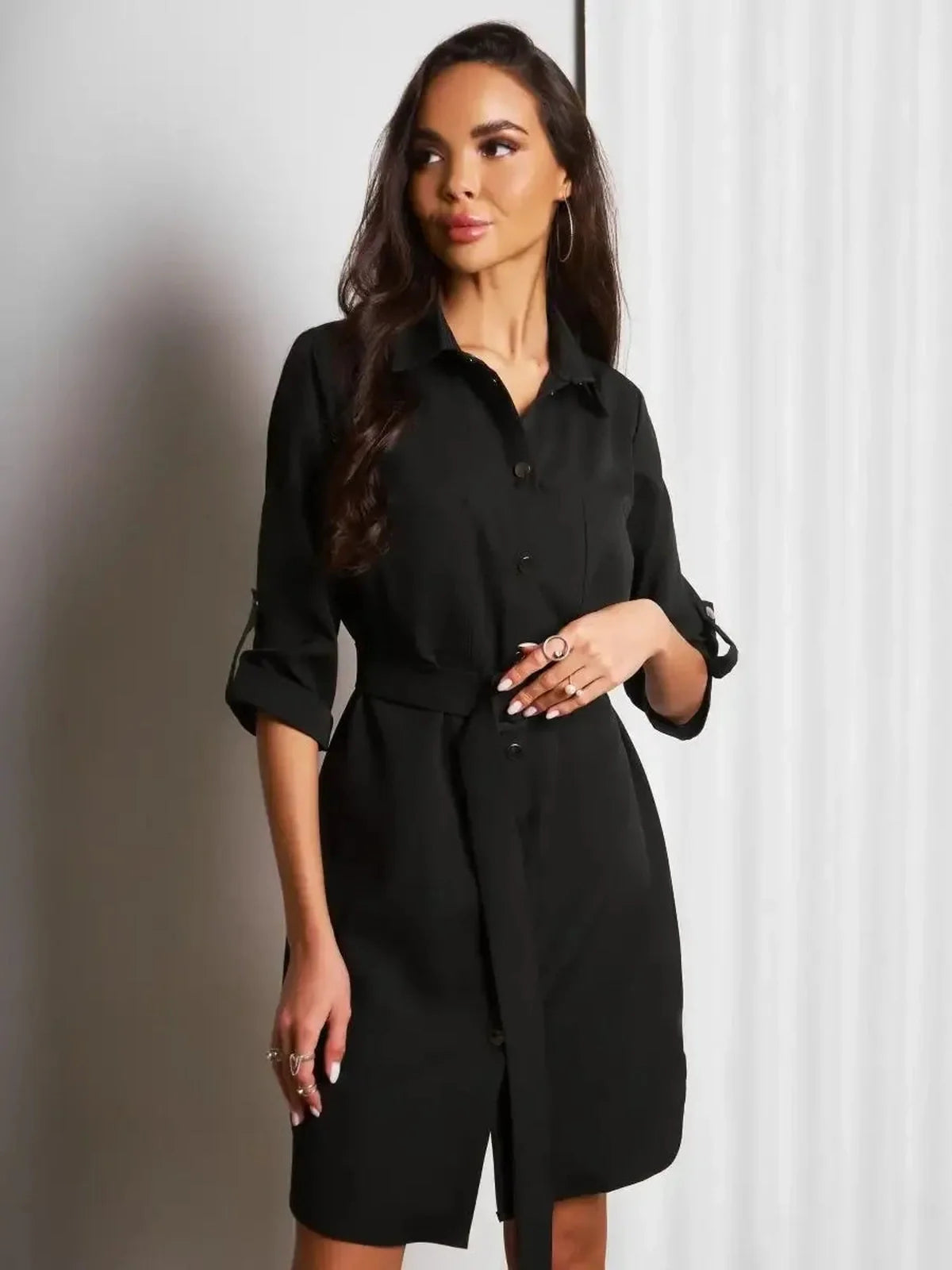 Urban Edit Mini black dress with structured silhouette, button-down closure, and detachable belt for stylish versatility.