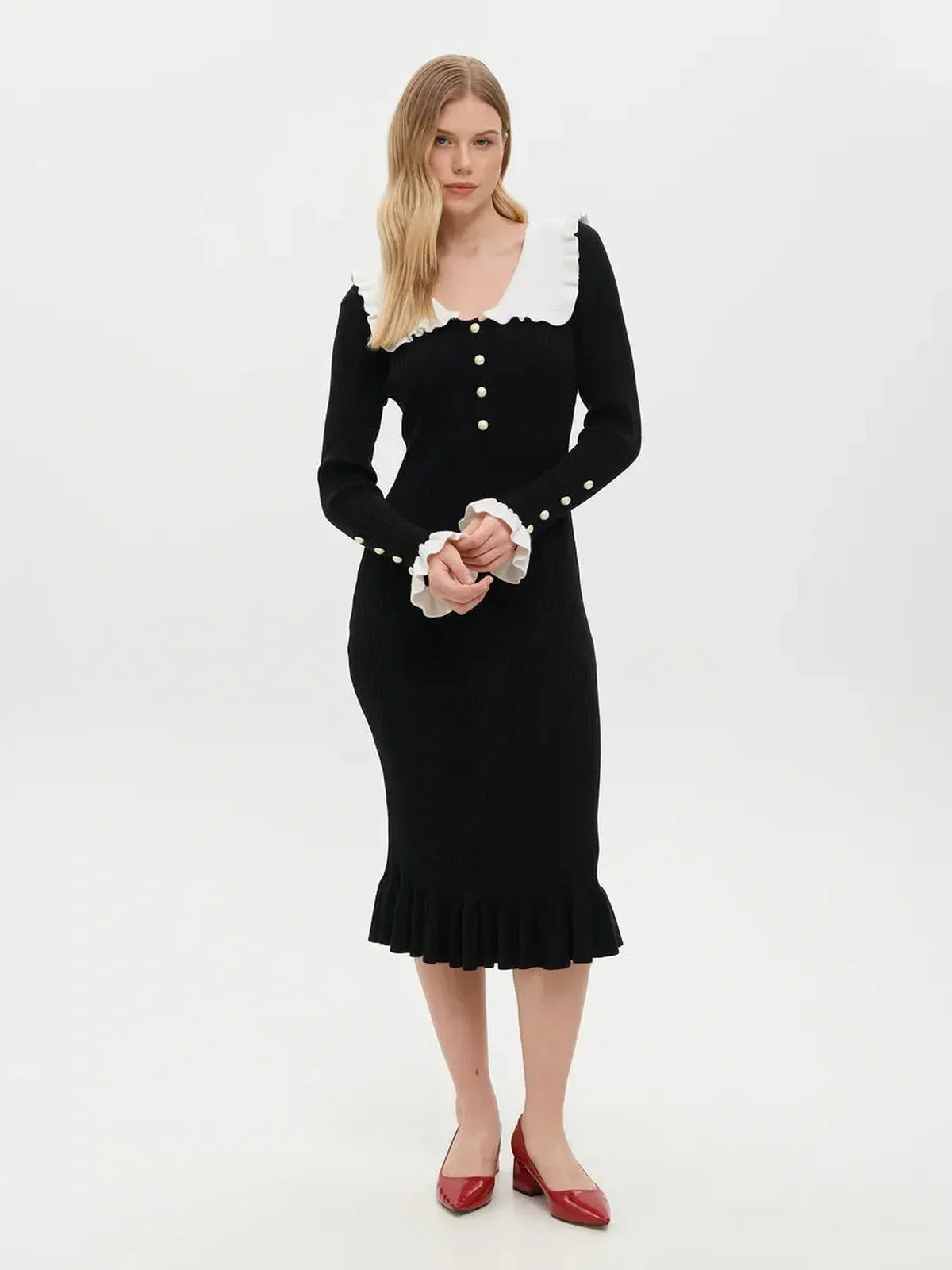 Elegant black midi dress with ruffle collar and pearl button details, perfect for weddings and formal occasions.