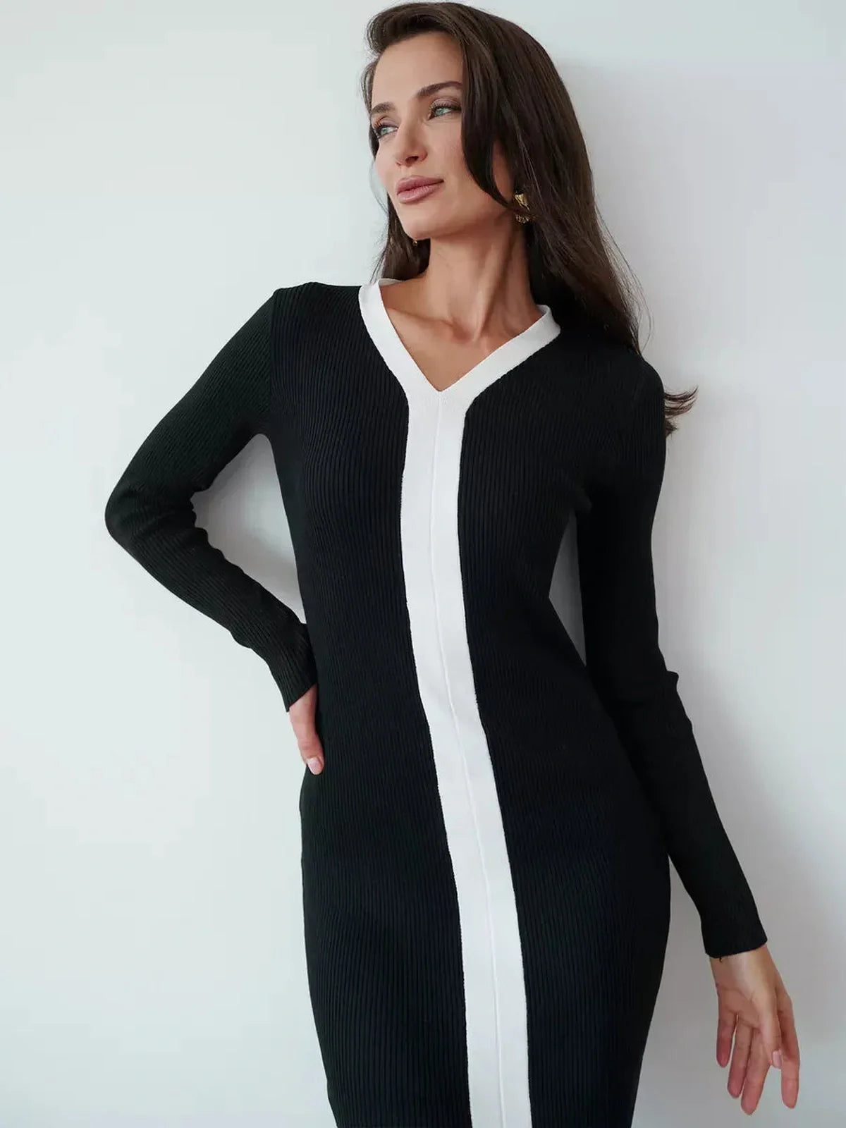 Elegant black midi dress with contrast white piping and V-neckline, perfect for formal events or as a wedding guest dress.