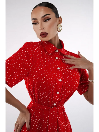 Model showcasing the vibrant red Scarlet Dot Midi Dress with polka dots and a flattering collar.