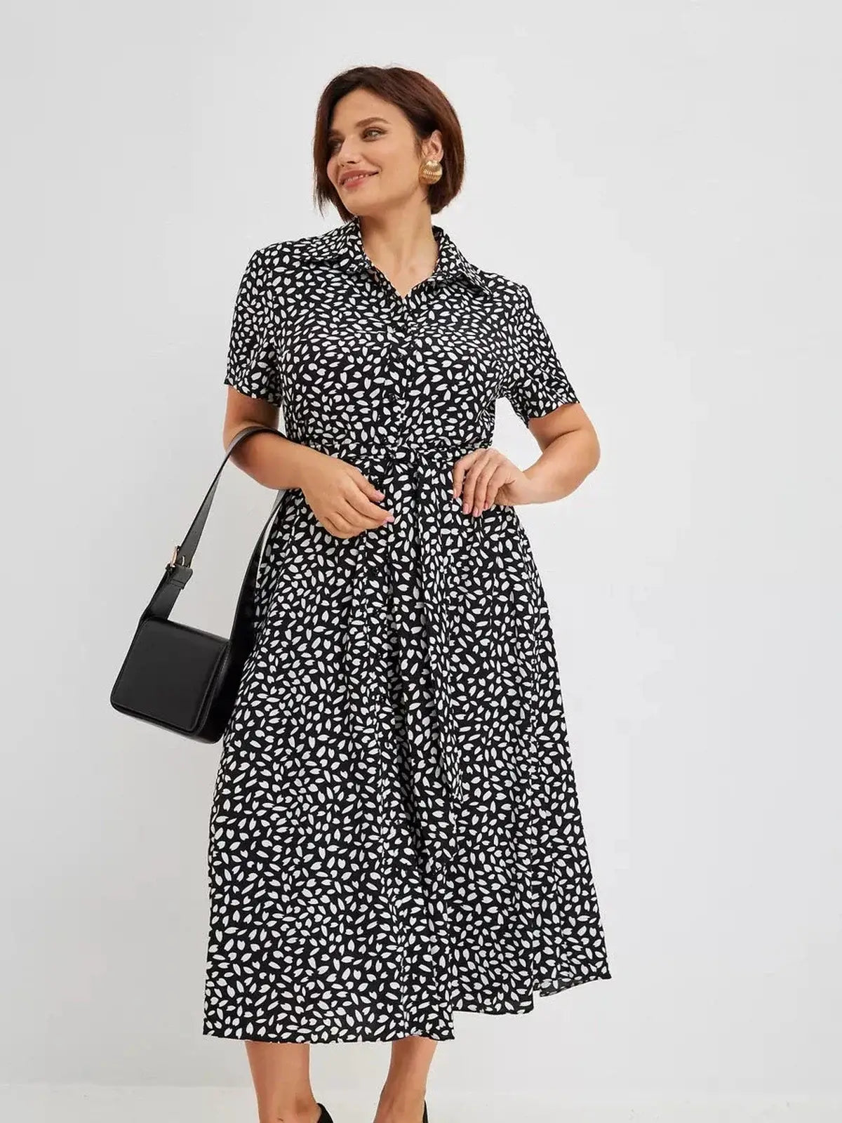 Monaco Midi Dress in black and white print, showcasing modern elegance for weddings and everyday wear.