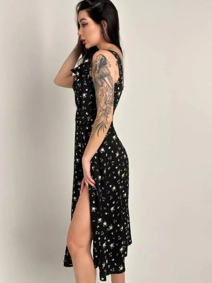Elysian Midi Dress in black floral design featuring romantic bows and side slit, perfect for summer occasions and special events.